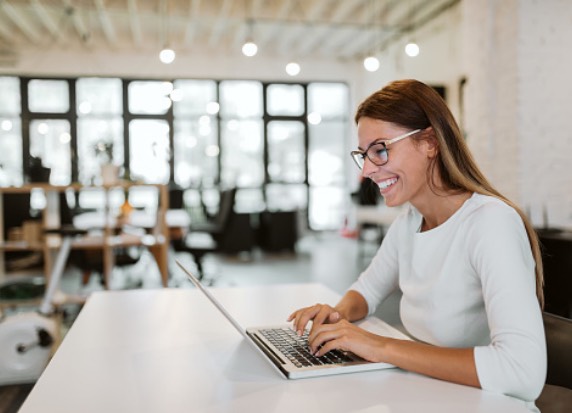 Woman working on laptop in office