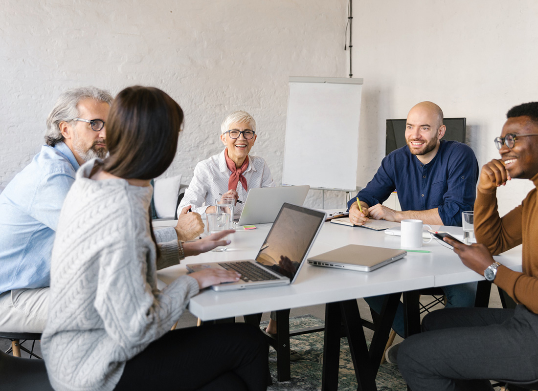 TR-Feature-02 Image of team collaborating around a table